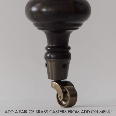 A Pair of Brass Casters in Front Legs