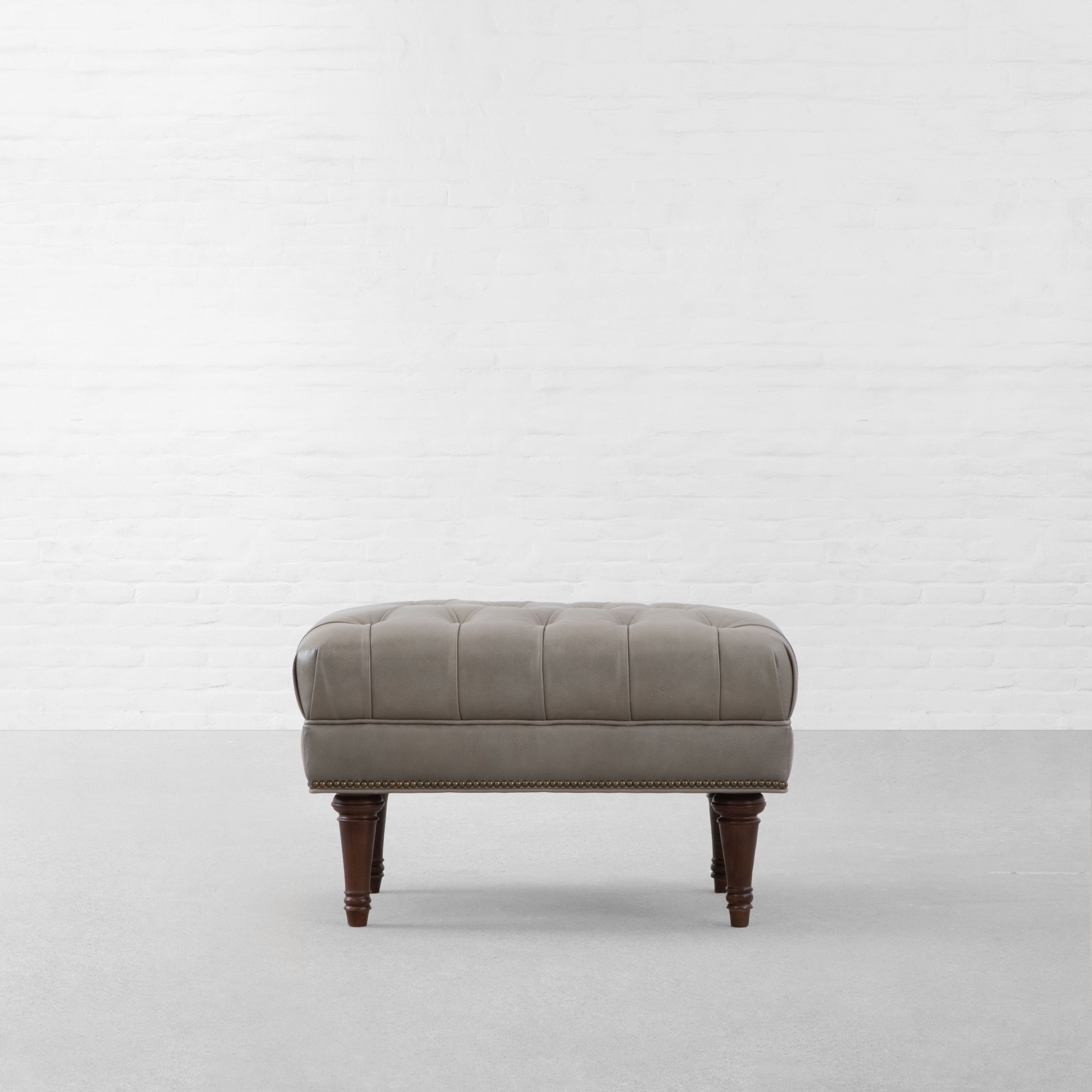 RYAN UPHOLSTERED LEATHER OTTOMAN